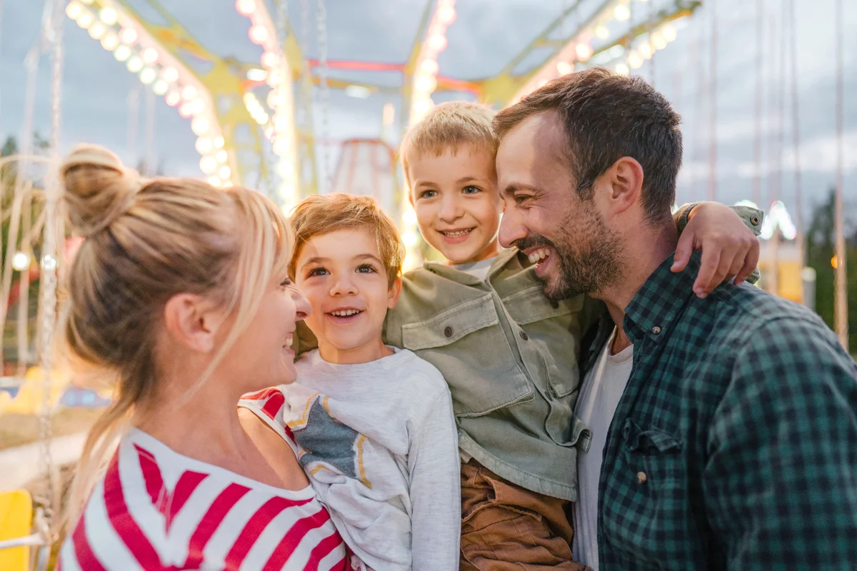 Happy family at the amusement park