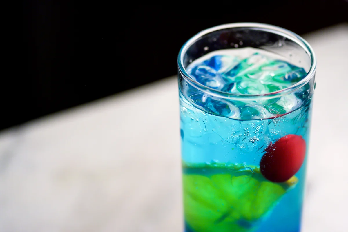 Blue drink with cherry and lemon