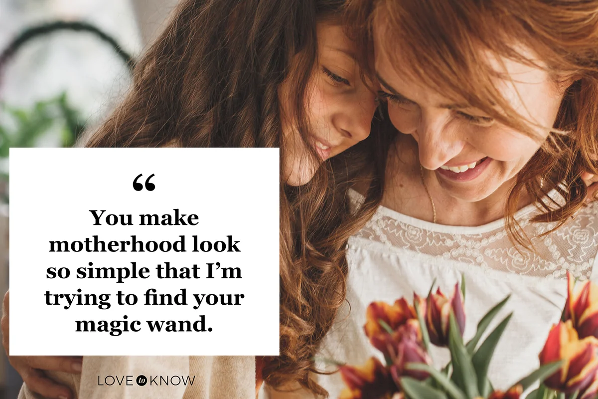 Happy mother and daughter hugging and holding a bouquet of fresh flowers