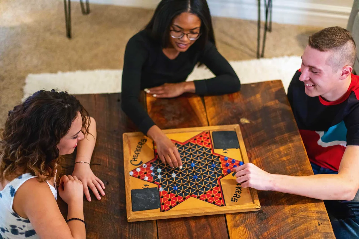 friends playing board game