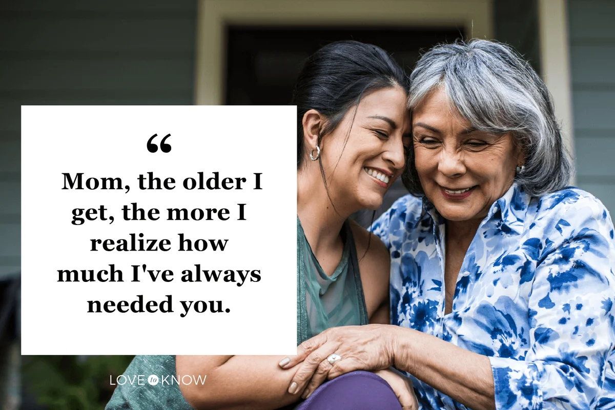 Senior woman and adult daughter laughing on porch