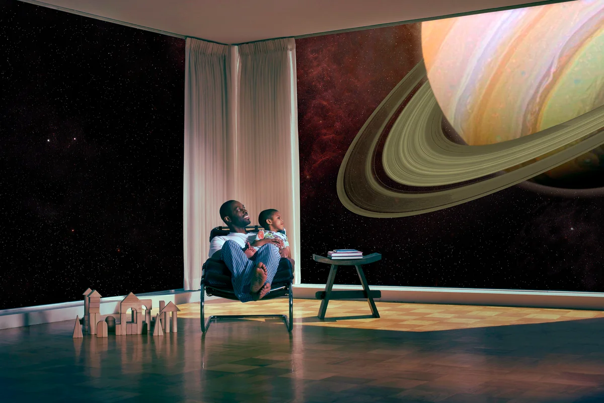 Father and son watching Saturn
