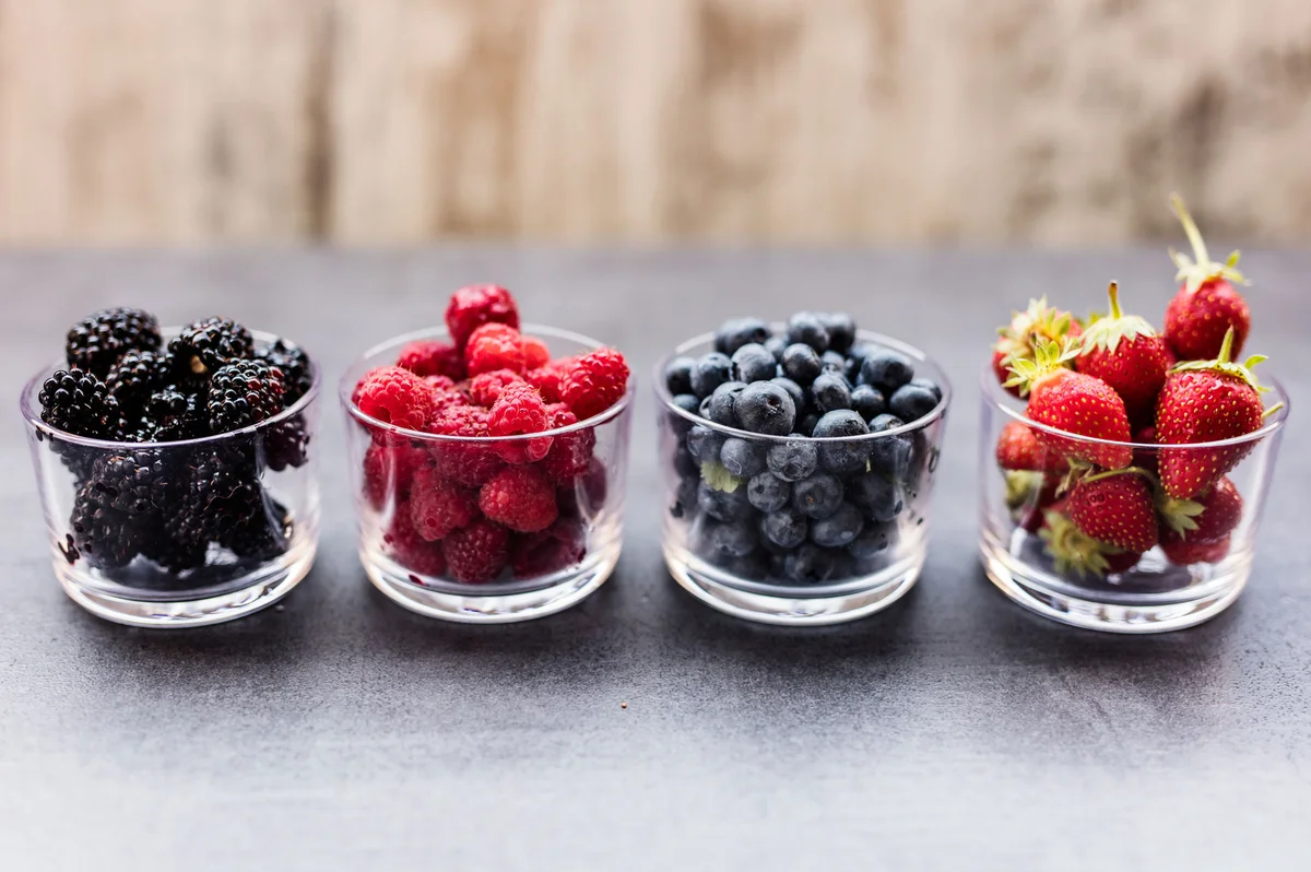 Bowls of blackberries, raspberries, blueberries and strawberries