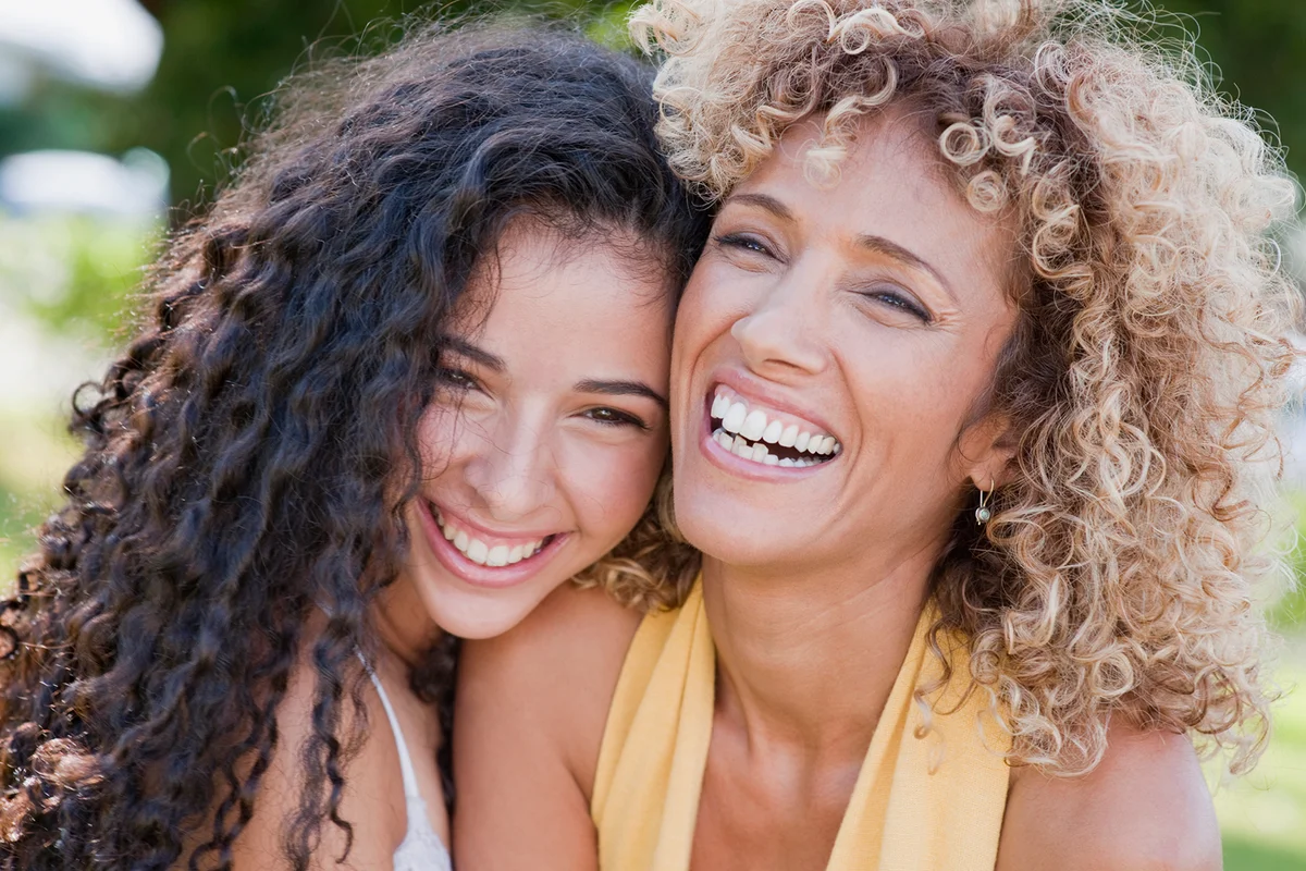 Mother and daughter laughing