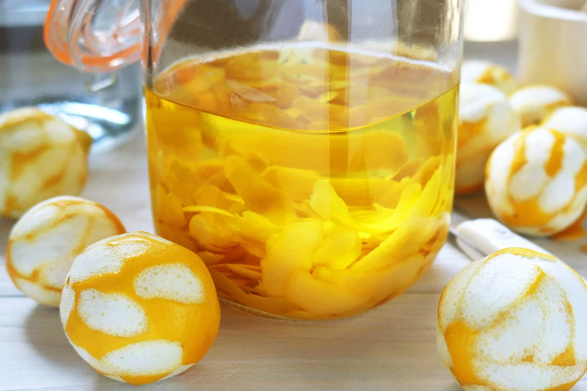 Lemons, lemon peels, and a canning jar