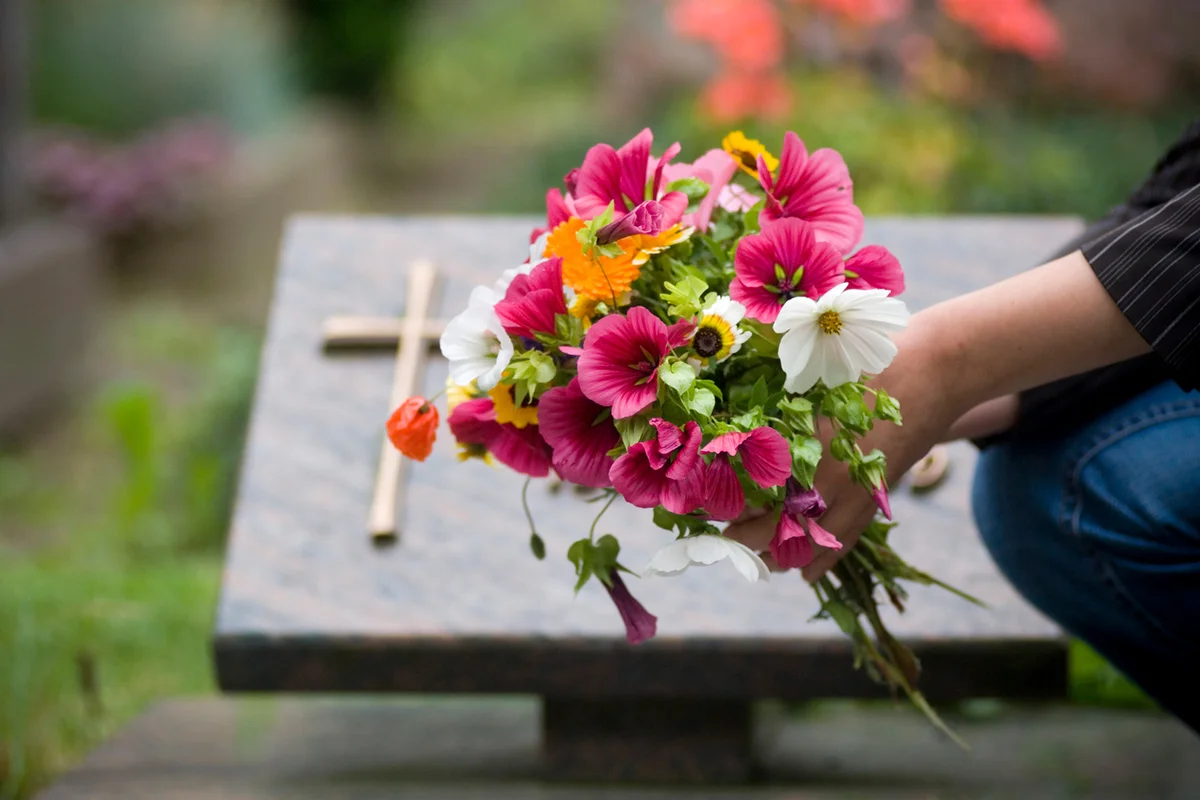 Leaving flowers on cemetery