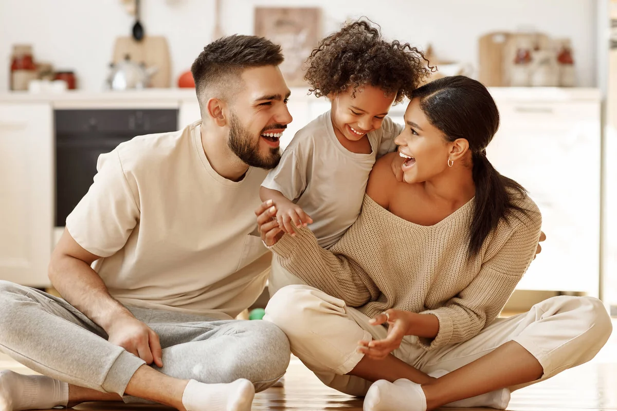 happy family mom, dad and child laughing