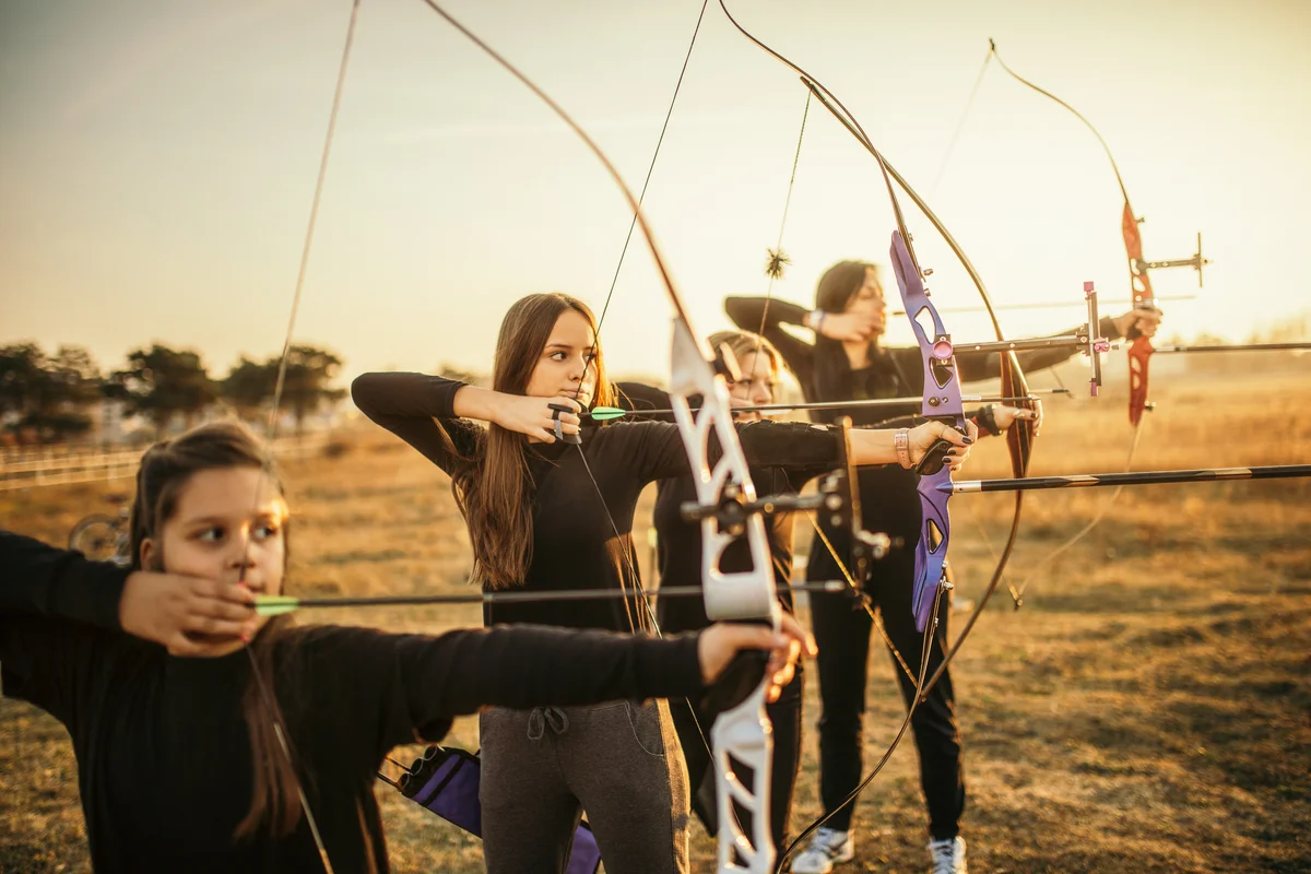 group shooting bow and arrow crossbows