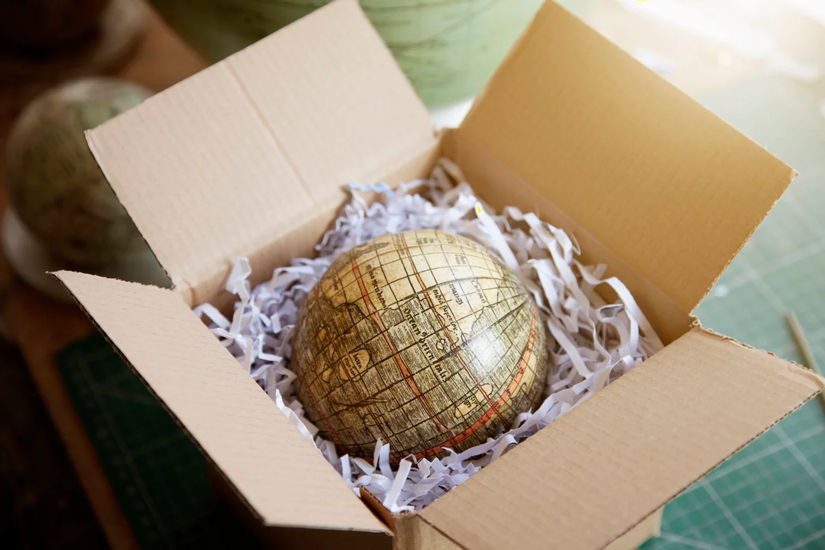Globe  in box ready to be sent to new owner