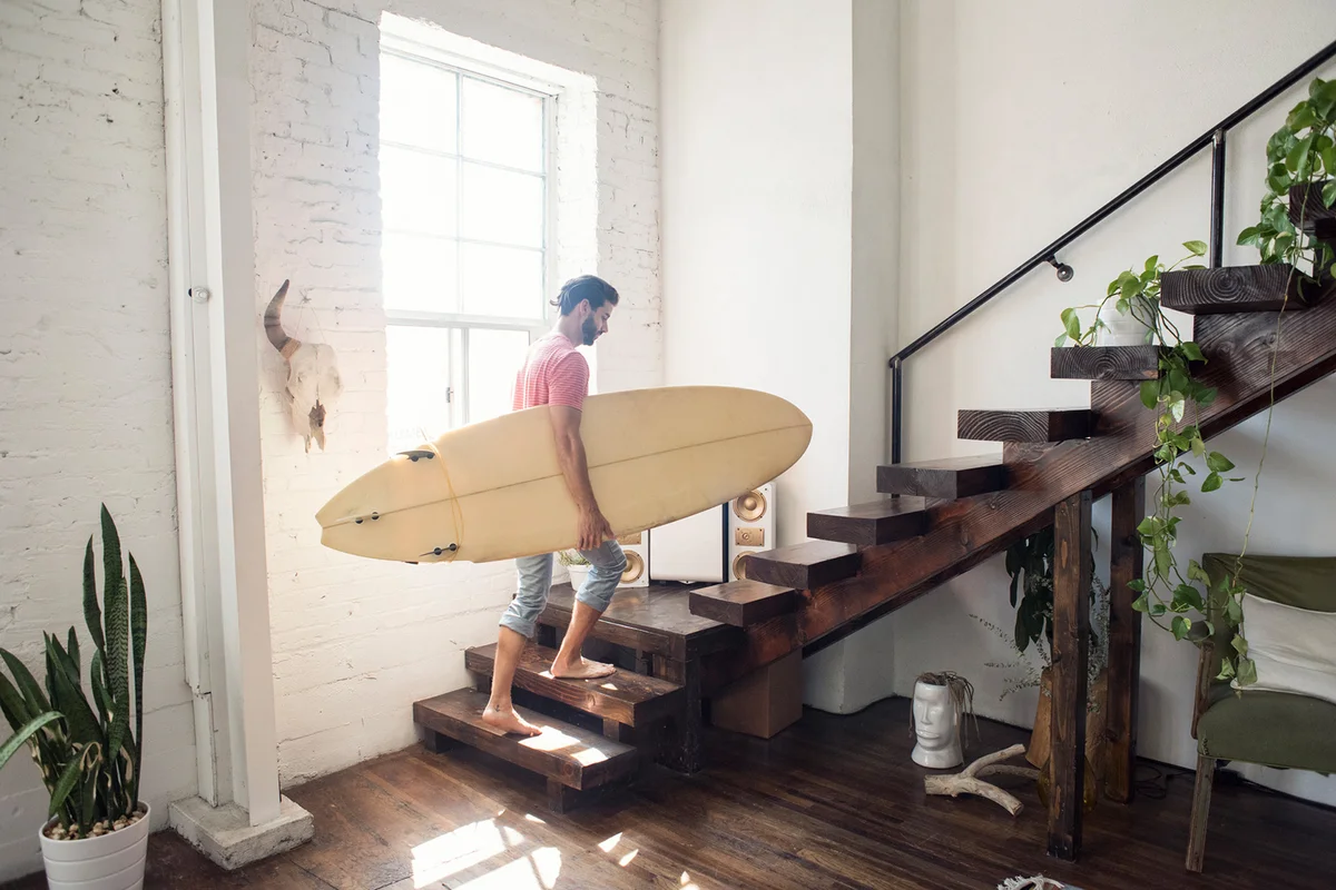 Young man on stairs in a loft