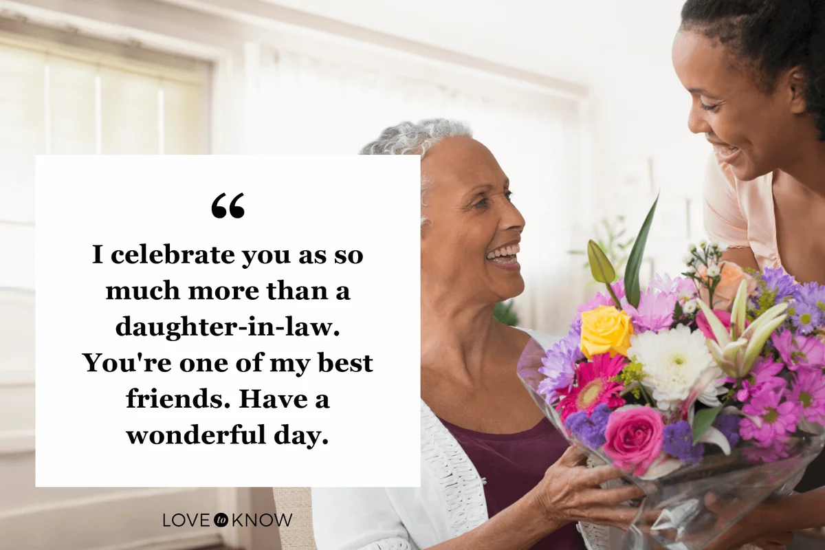 Woman giving daughter in law a bouquet of flowers