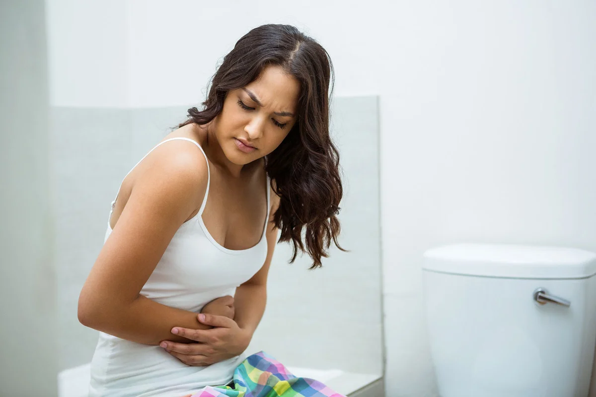 Woman feeling sick to stomach