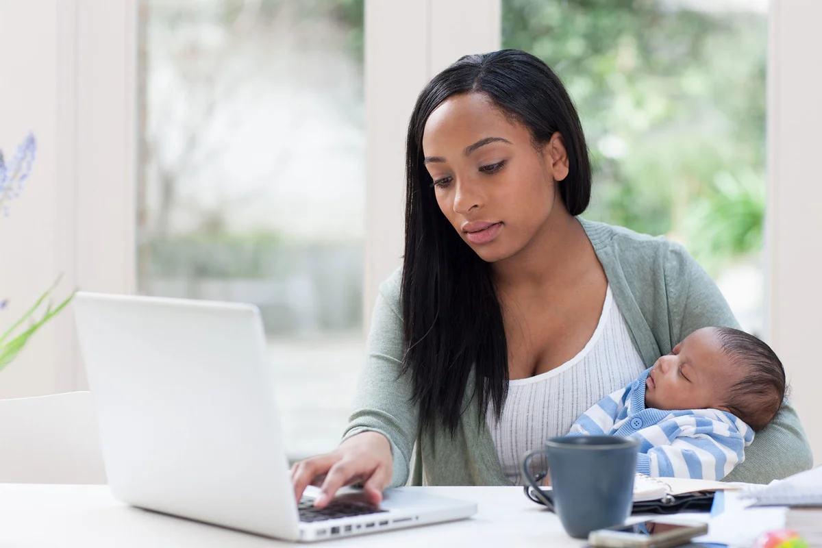 Business woman with newborn baby
