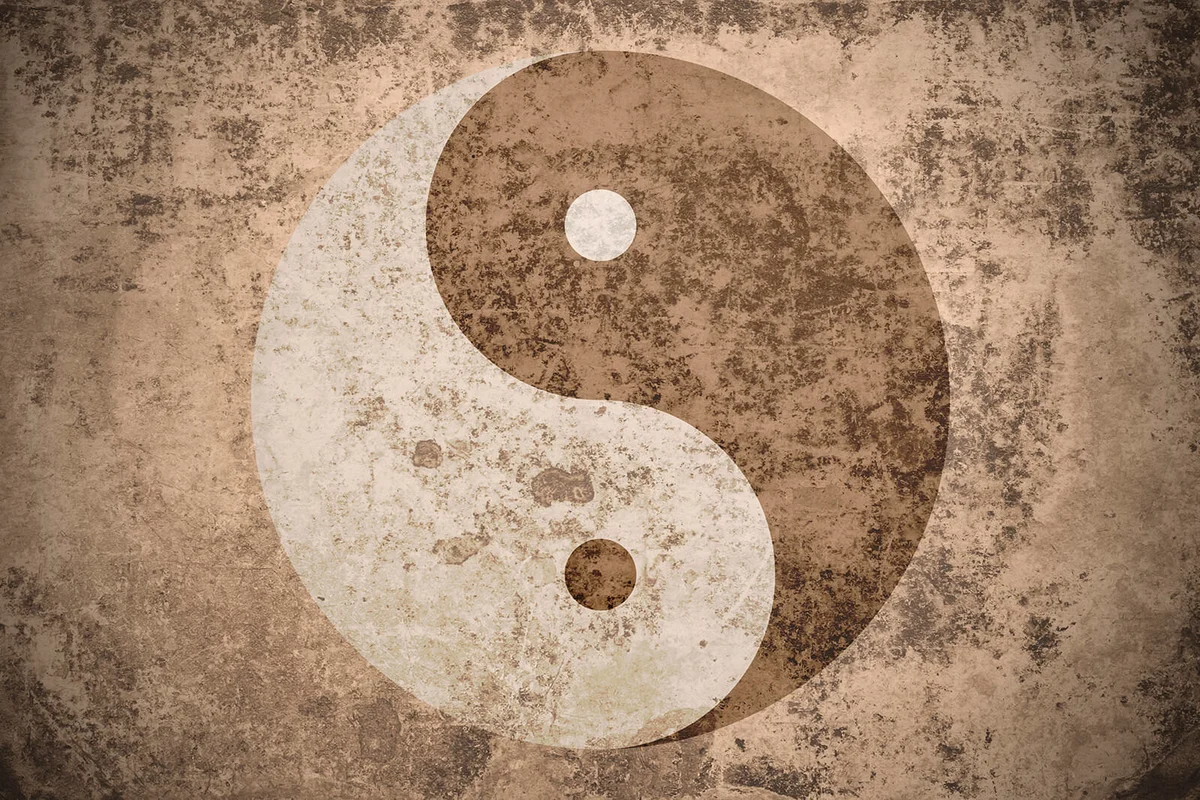 in Yang Symbol On Weathered Wall