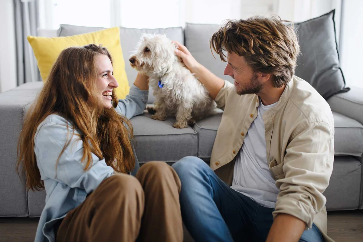 Capricorn man with partner and their dog