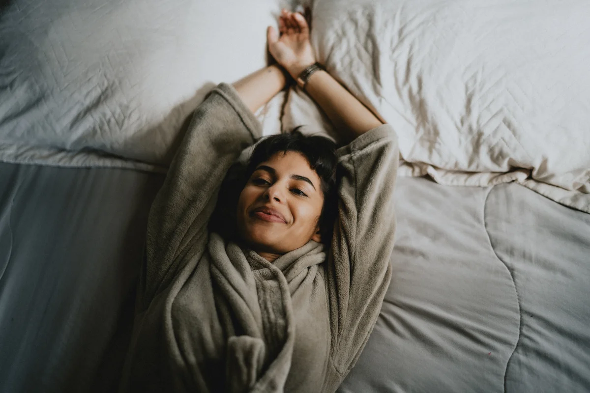 woman resting on bed