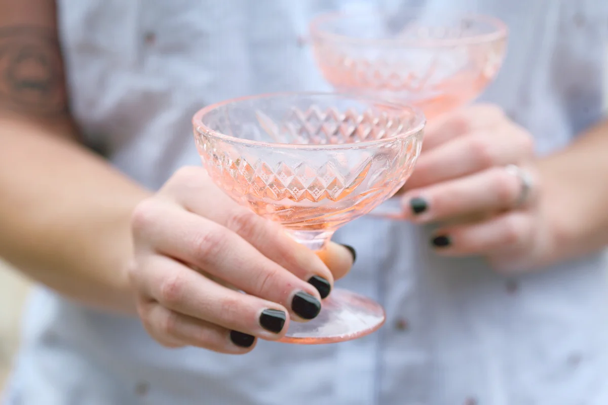 Woman Holding pink depression glasses