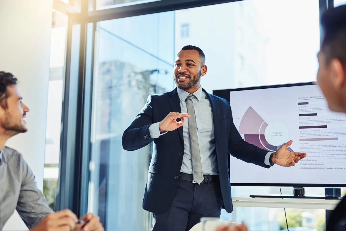 successful business man with good work ethic giving presentation in meeting