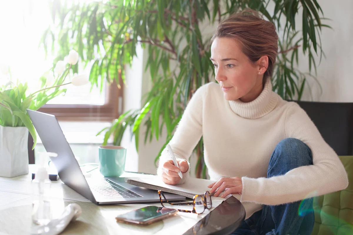 Woman working from home using laptop computer