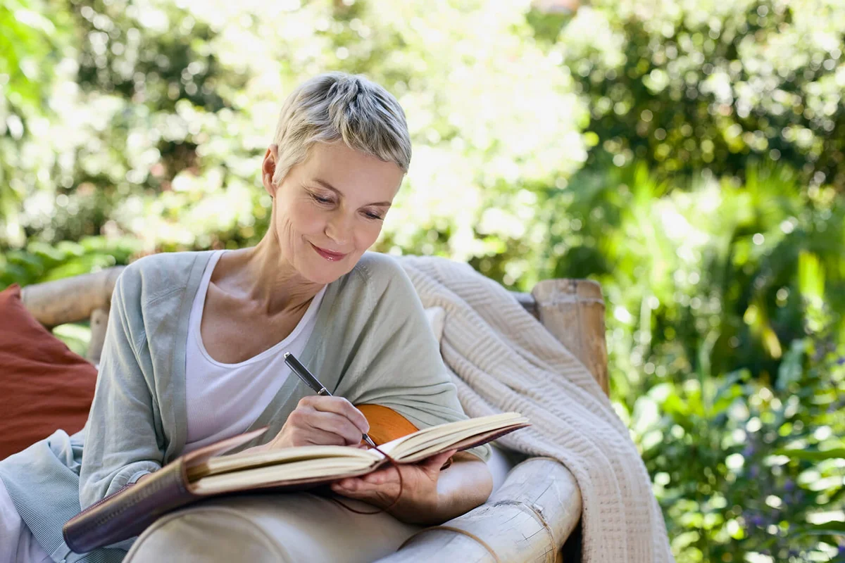 Woman writing in a journal