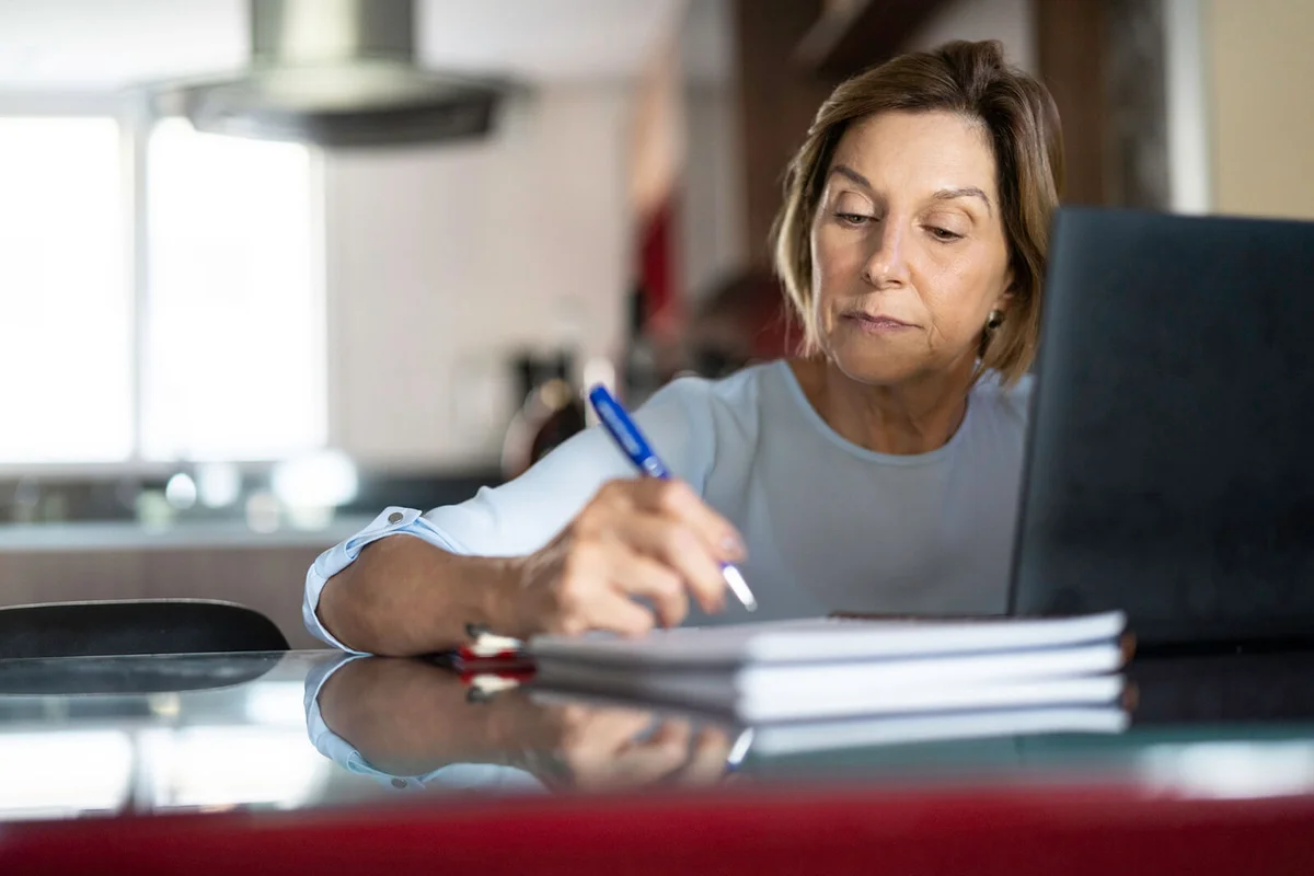 Mature woman working at home