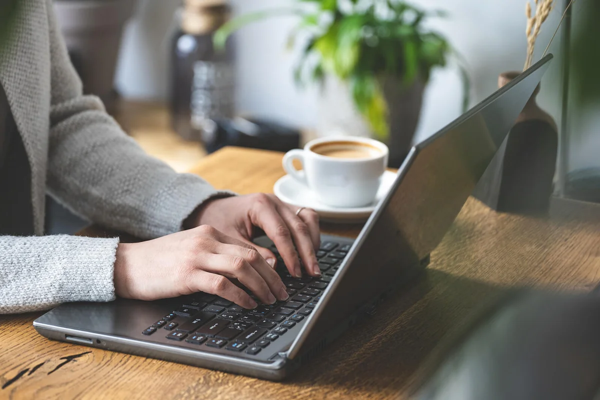 woman working behind her laptop
