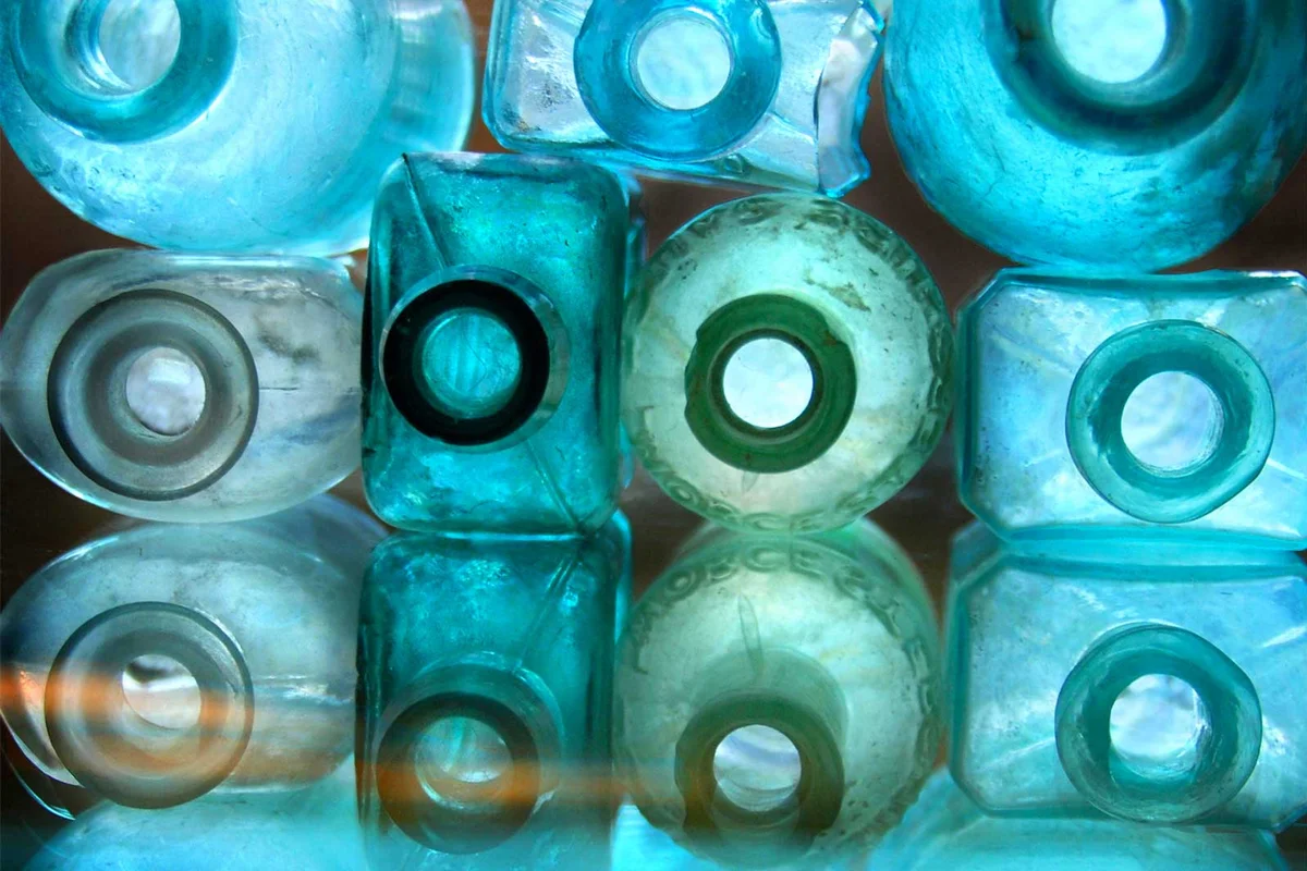 antique bottle lined up on table
