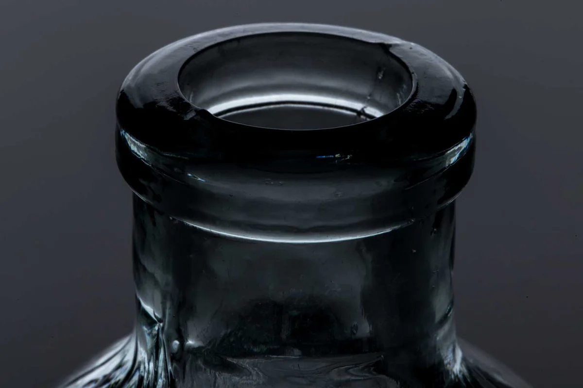 lip of antique bottle