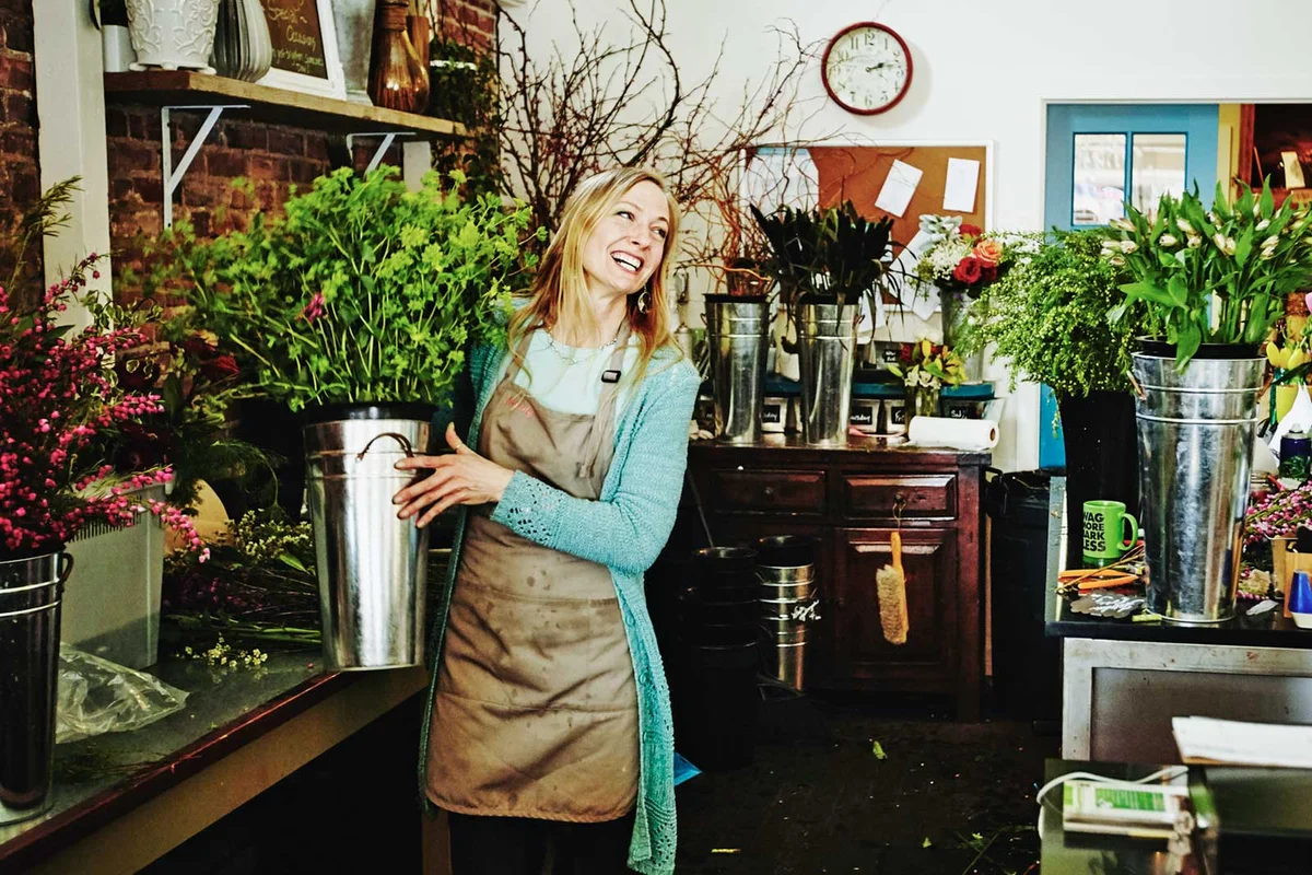 happy woman working in florist shop