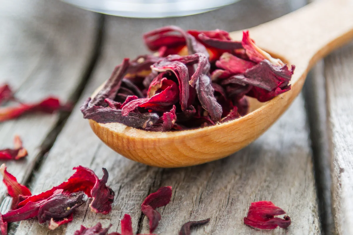 Dry hibiscus in wood spoon