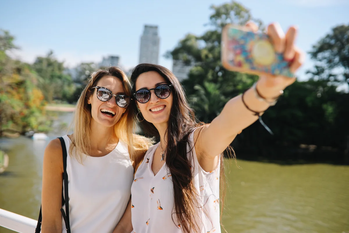 couple taking selfie while traveling