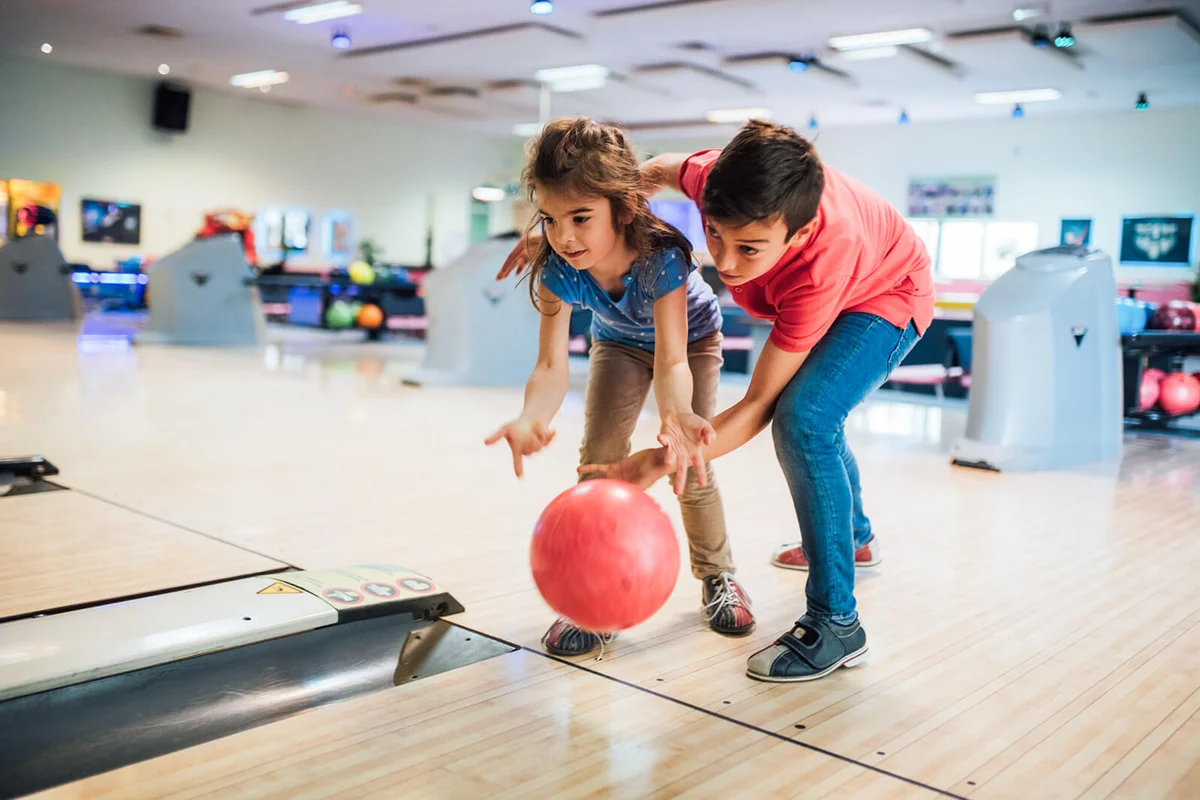 Sister and brother bowling