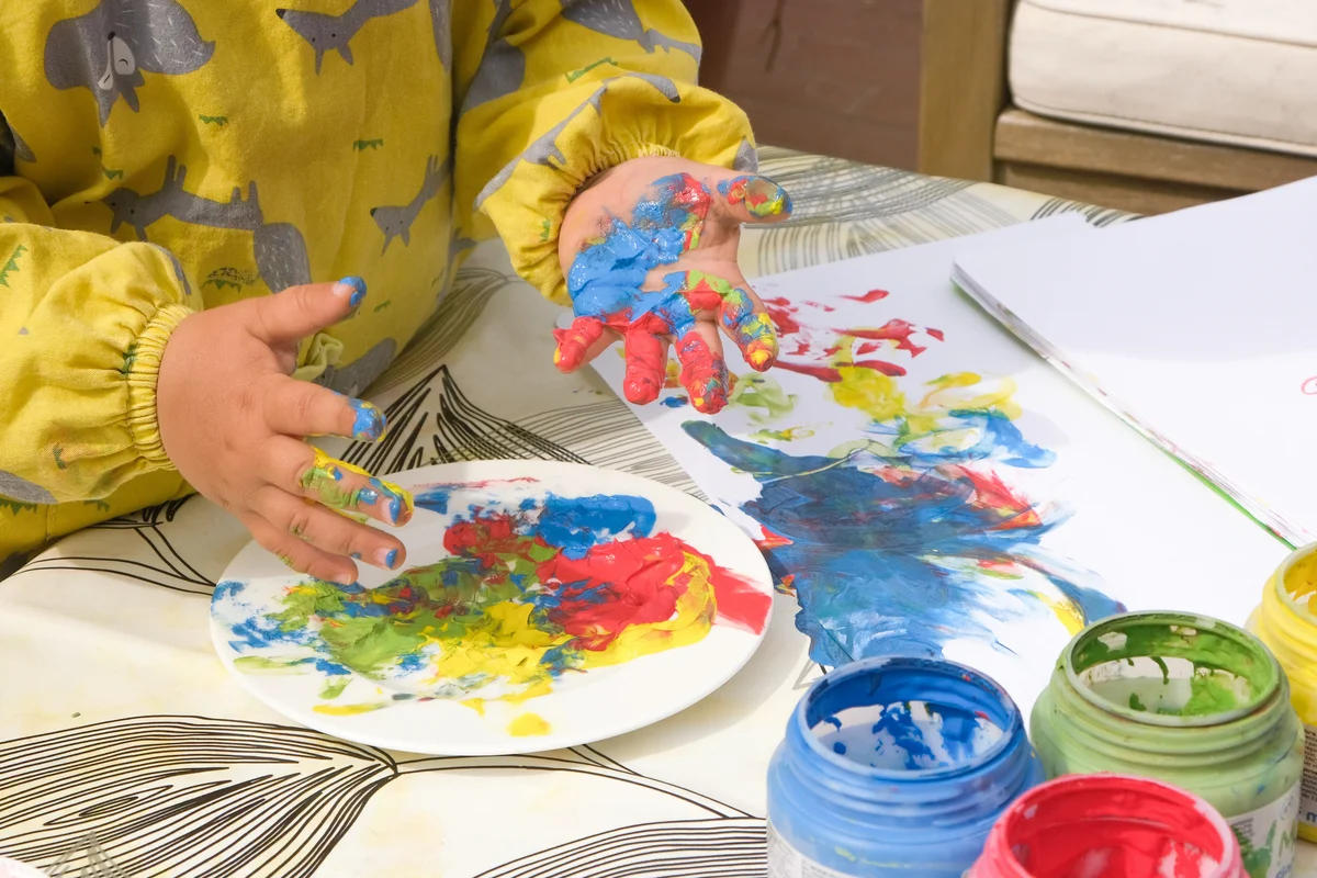 Finger painting outside on a sunny day