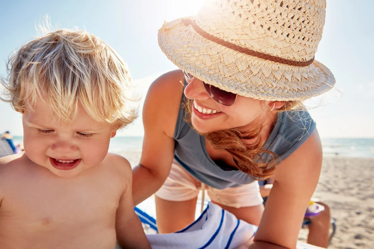 Mother spending the day at the beach with her little boy