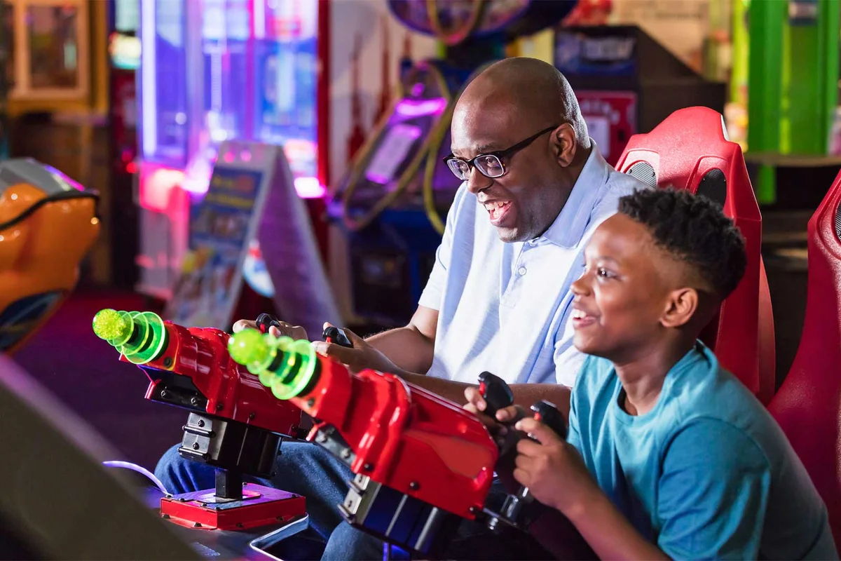 father and son at arcade