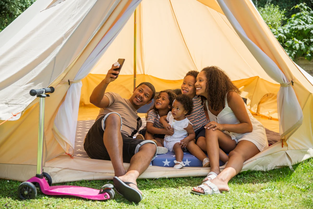 family camping in the backyard