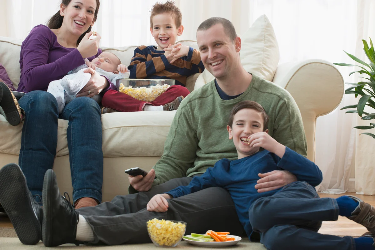 fathers day movie marathon family watching television together eating popcorn