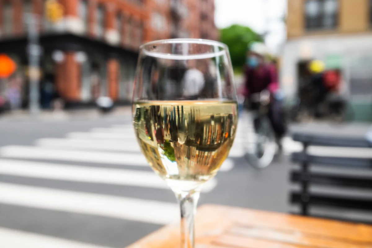 white wine glass nyc city street restaurant