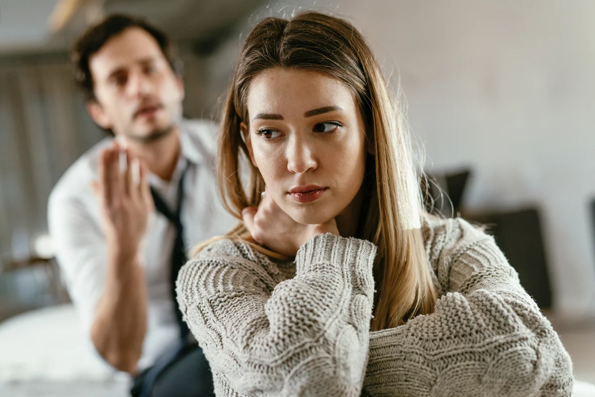 Angry man is yelling at his wife