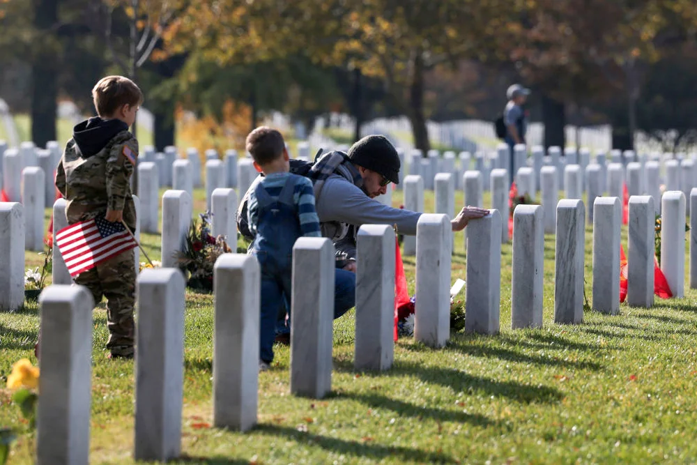 Army veteran and his sons visit the gravesite on Memorial Day