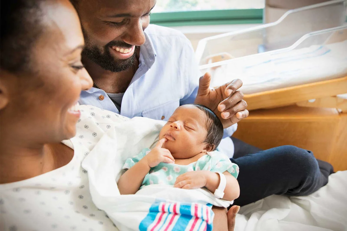 parents with newborn baby at hospital