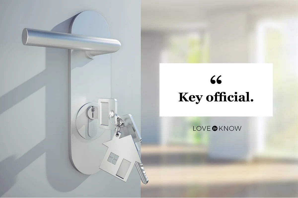 Key in the door lock of open modern door