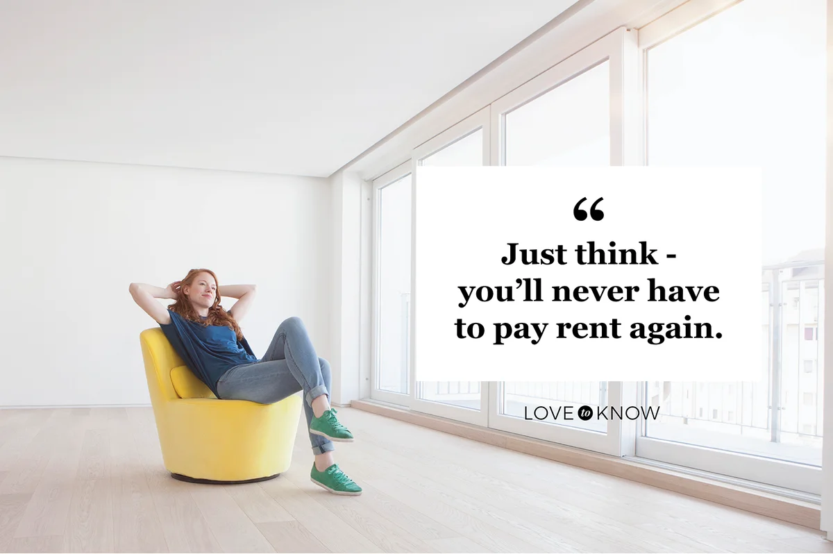 Young woman sitting on yellow armchair in her empty living room