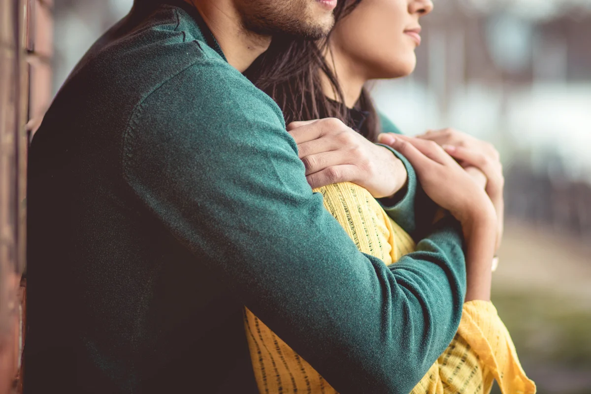 Couple holding each other at the park