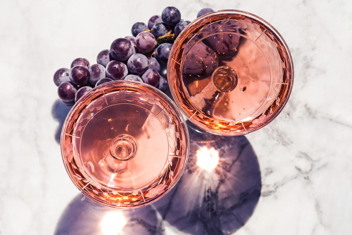 Two crystal stemmed glasses with rose wine