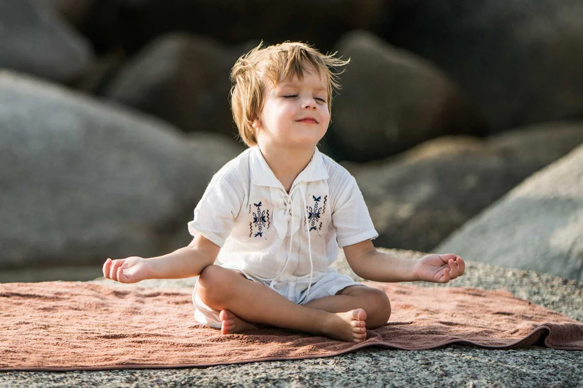 young boy practicing mindfulness