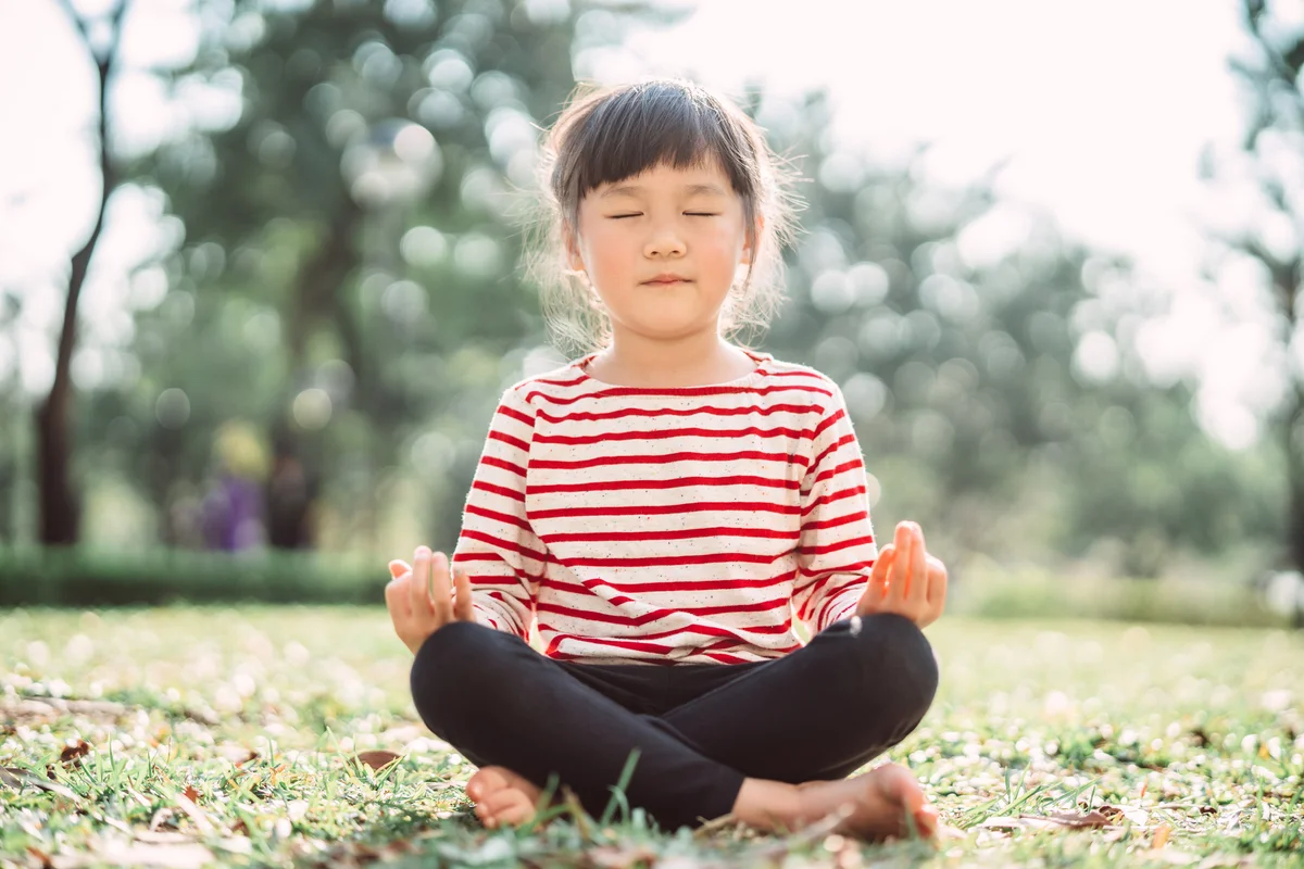 young girl practicing mindfulness