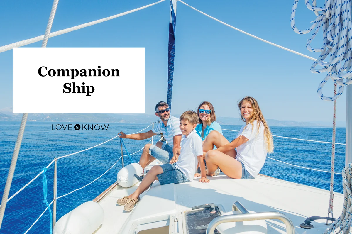 Family with adorable kids resting on yacht