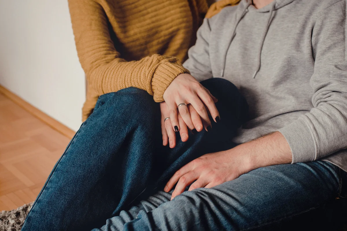 Couple sitting on the floor talking
