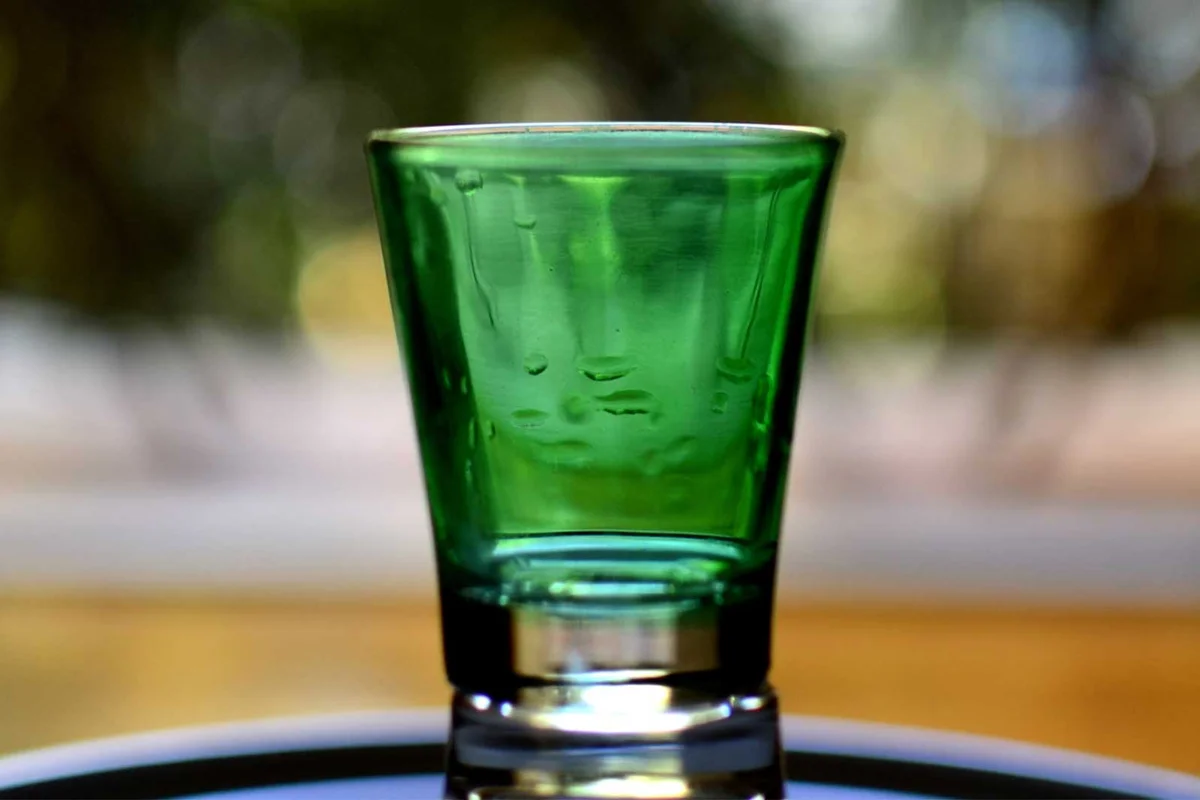 green shot glass on table